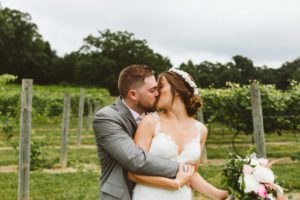 kissing at black barn vineyard and winery wedding michigan