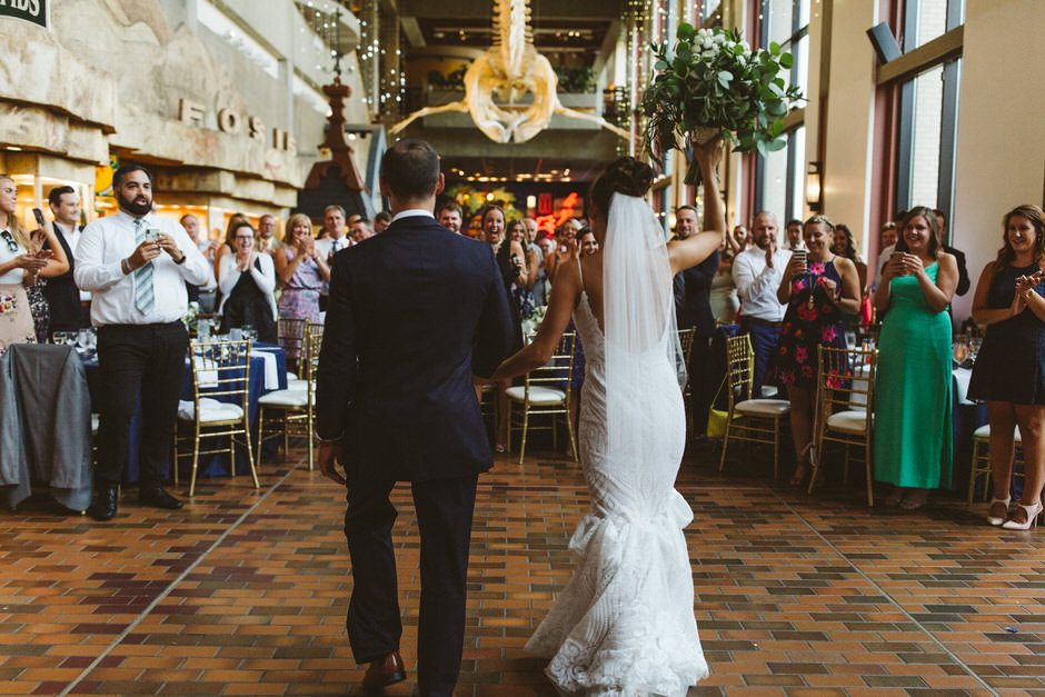 Grand Rapids Public Art Museum Wedding couple entering reception 