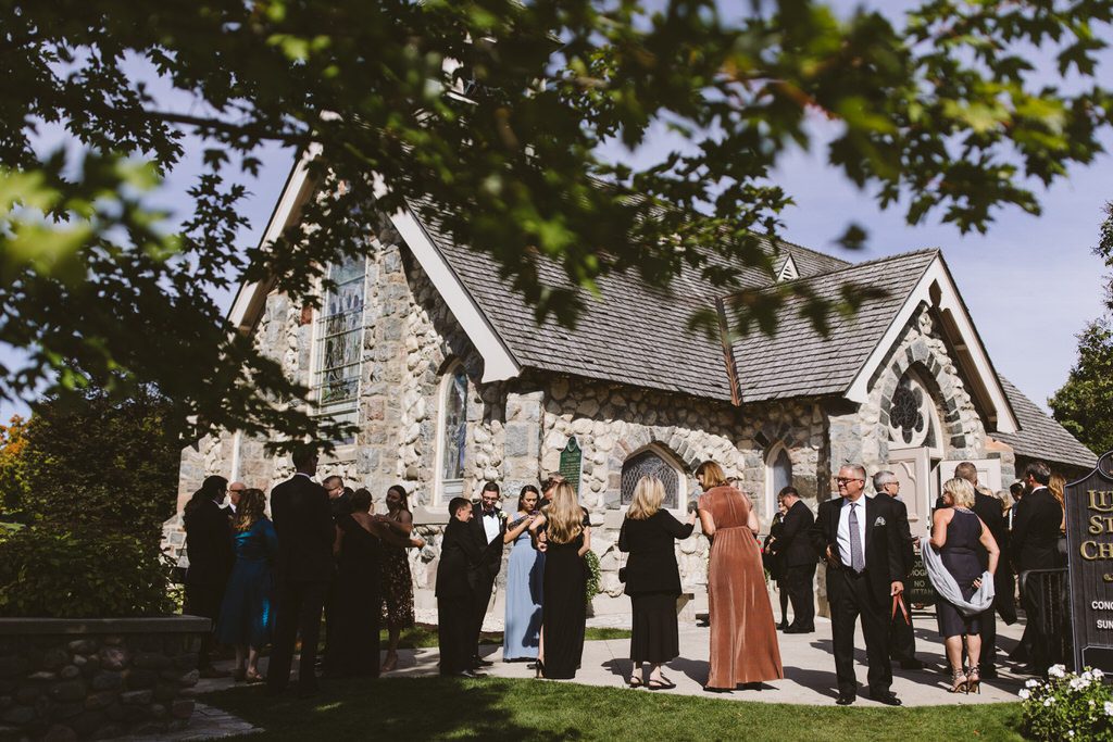 guests waiting for the ceremony outside of Little Stone Church on Mackinac Island MI 