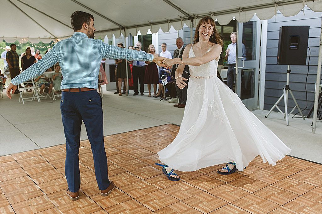 Couple dancing to bluegrass at forest wedding reception
