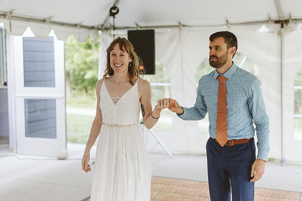 Couple dancing to bluegrass at forest wedding reception