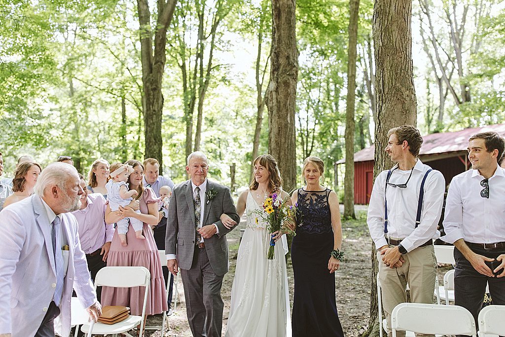 Outdoor ceremony under trees at Fenner Nature Center in Lansing, Michigan
