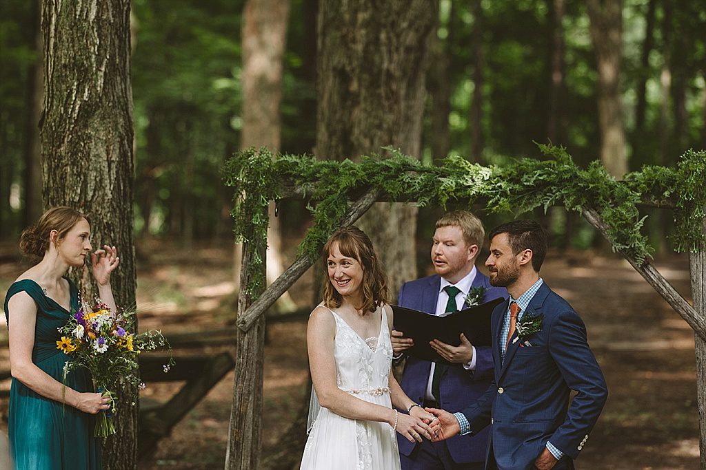 Outdoor ceremony under trees at Fenner Nature Center in Lansing, Michigan