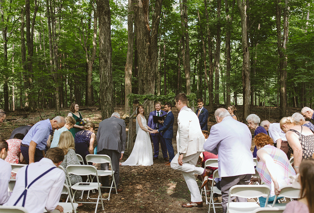 Outdoor ceremony under trees at Fenner Nature Center in Lansing, Michigan